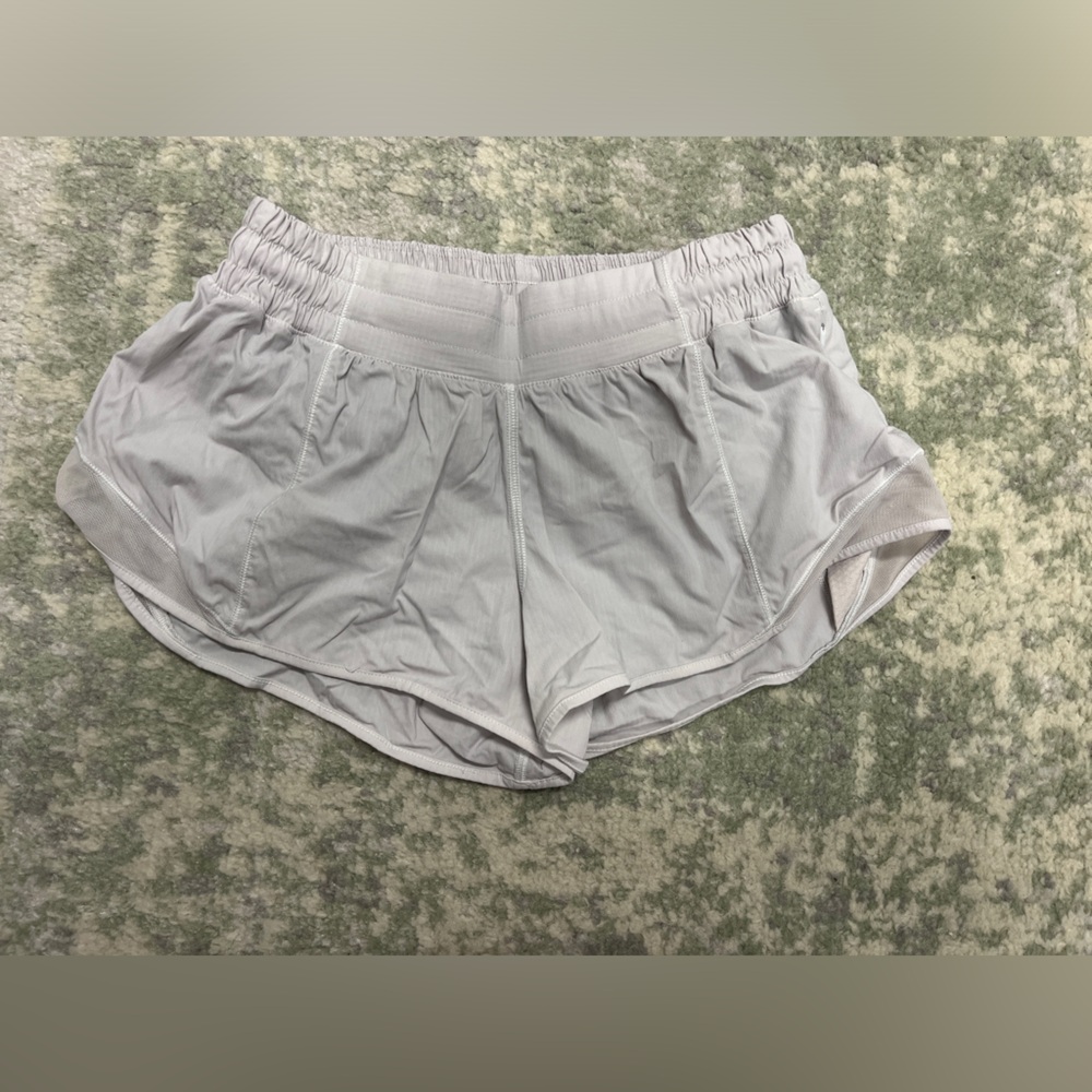 Size 4 “Hotty hot” 2.5” LuluLemon white shorts in great condition